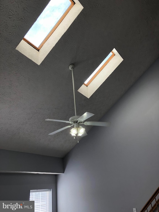 details with a textured ceiling and ceiling fan