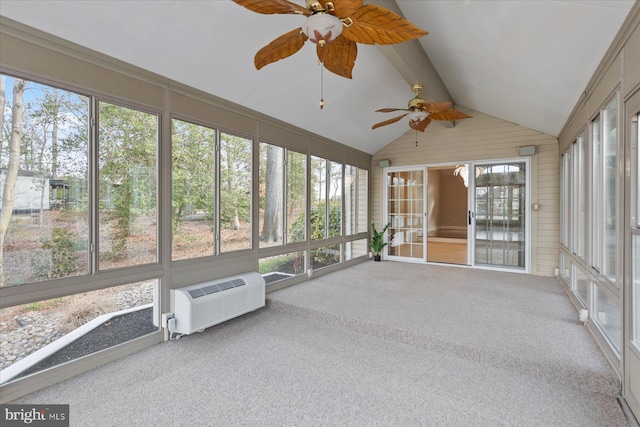 unfurnished sunroom featuring a wall unit AC, beamed ceiling, and ceiling fan