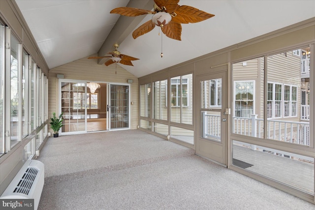 unfurnished sunroom featuring a healthy amount of sunlight, an AC wall unit, and a ceiling fan