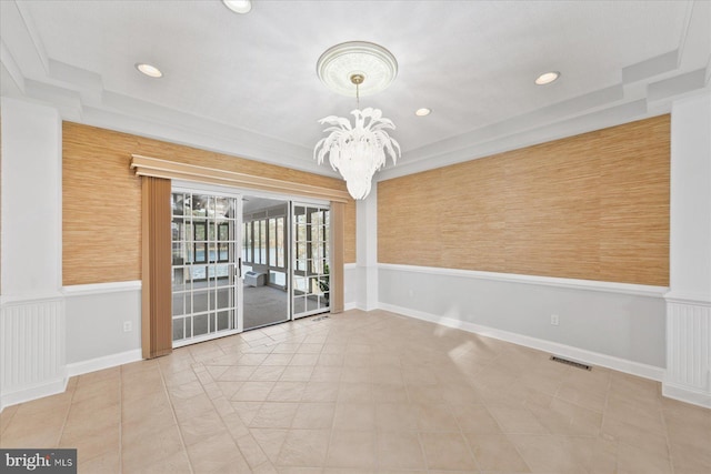 unfurnished room with a wainscoted wall, visible vents, a chandelier, and recessed lighting