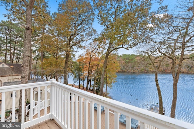 wooden deck with a water view