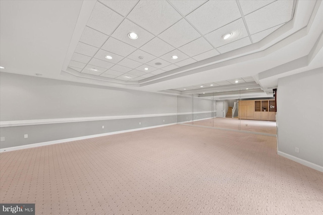 finished below grade area with baseboards, recessed lighting, and carpet