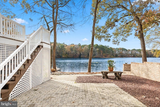 property view of water featuring stairs