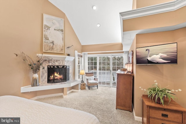carpeted bedroom with baseboards, lofted ceiling, a premium fireplace, and recessed lighting