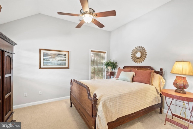 carpeted bedroom featuring baseboards, vaulted ceiling, and ceiling fan