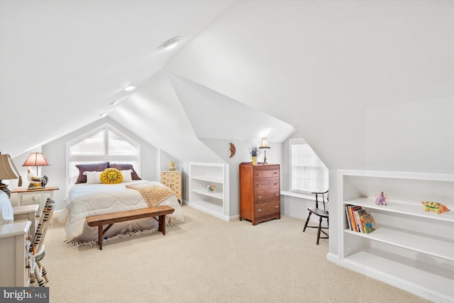 carpeted bedroom featuring vaulted ceiling