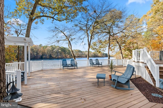 wooden deck with a water view