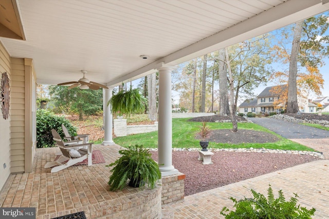 view of patio / terrace with a ceiling fan and a residential view