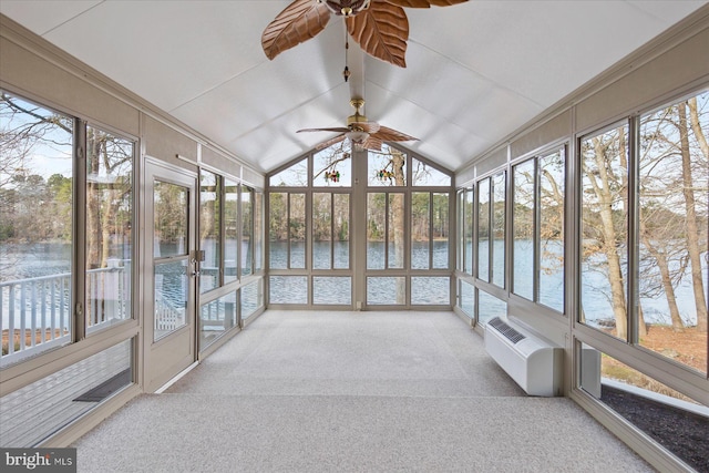 sunroom featuring an AC wall unit, a water view, and ceiling fan