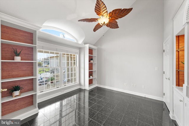 spare room with high vaulted ceiling, visible vents, baseboards, a ceiling fan, and granite finish floor