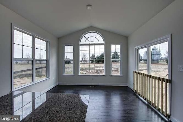 unfurnished sunroom with vaulted ceiling