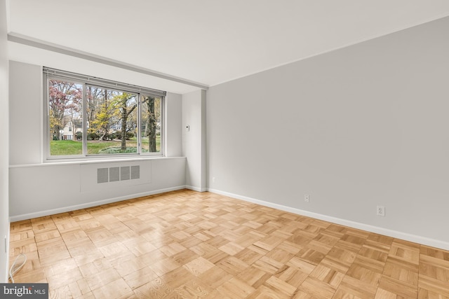 empty room with light parquet floors