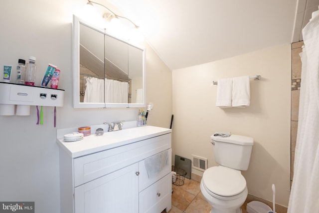 bathroom with tile patterned flooring, vanity, and toilet