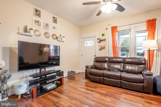 living room with hardwood / wood-style flooring and ceiling fan