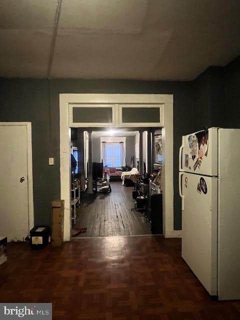 hallway featuring dark hardwood / wood-style flooring