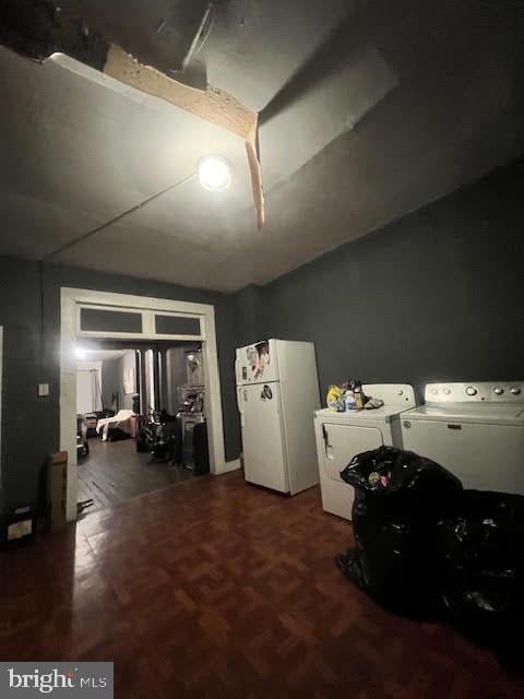 misc room featuring washer and clothes dryer and parquet floors