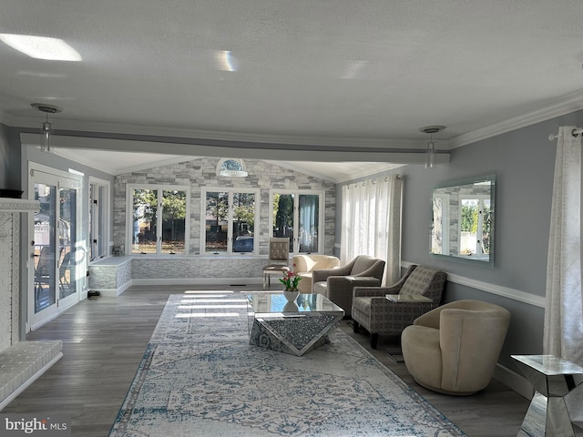 living room with crown molding, dark hardwood / wood-style floors, and a textured ceiling