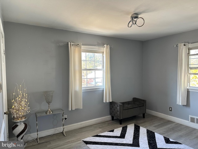 living area with light hardwood / wood-style flooring