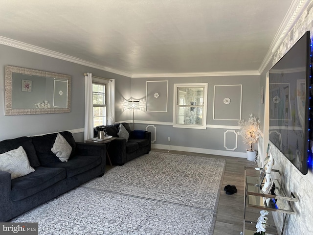 living room with hardwood / wood-style floors and ornamental molding