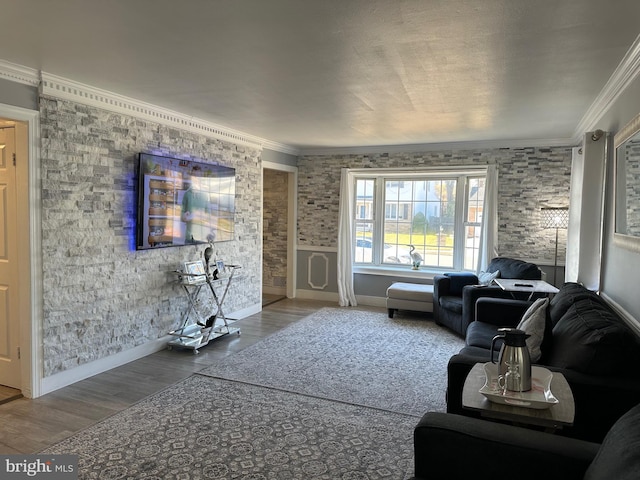 living room with wood-type flooring and ornamental molding