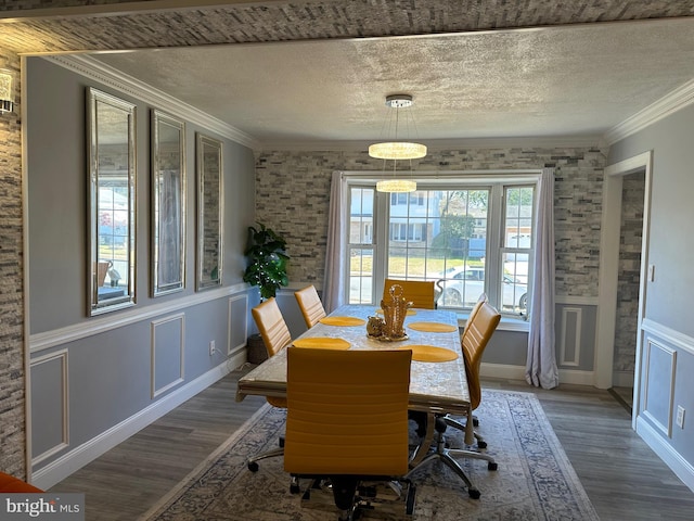 dining room featuring crown molding and dark hardwood / wood-style flooring