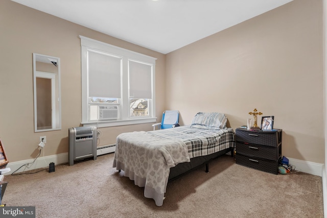 carpeted bedroom with cooling unit and a baseboard heating unit