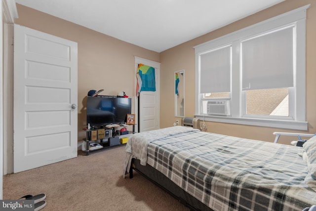 bedroom featuring carpet flooring and cooling unit