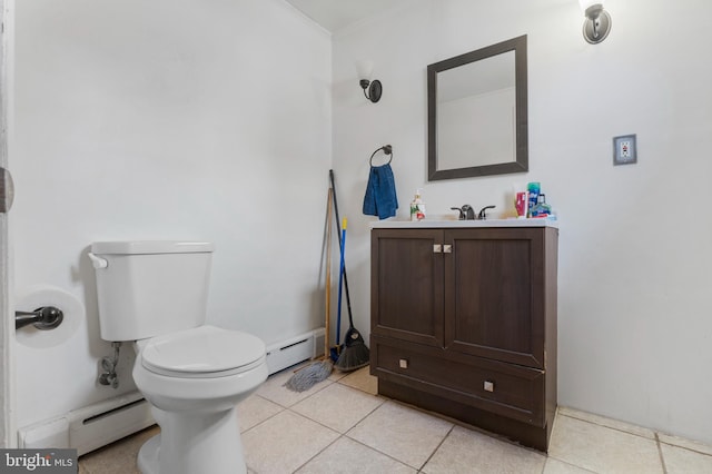 bathroom featuring tile patterned flooring, vanity, ornamental molding, and baseboard heating