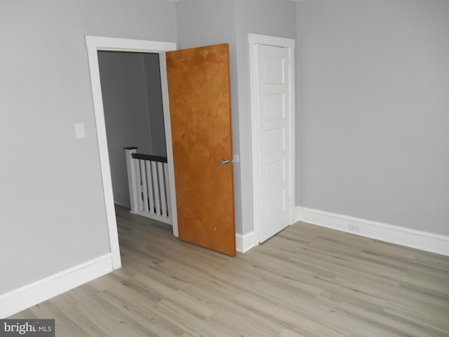 spare room featuring light wood-type flooring