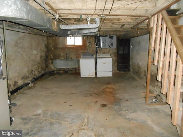 basement featuring sink and electric panel