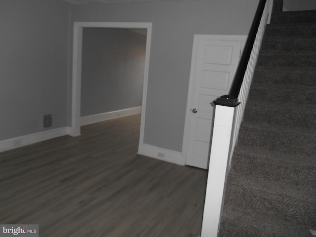 stairs with hardwood / wood-style flooring