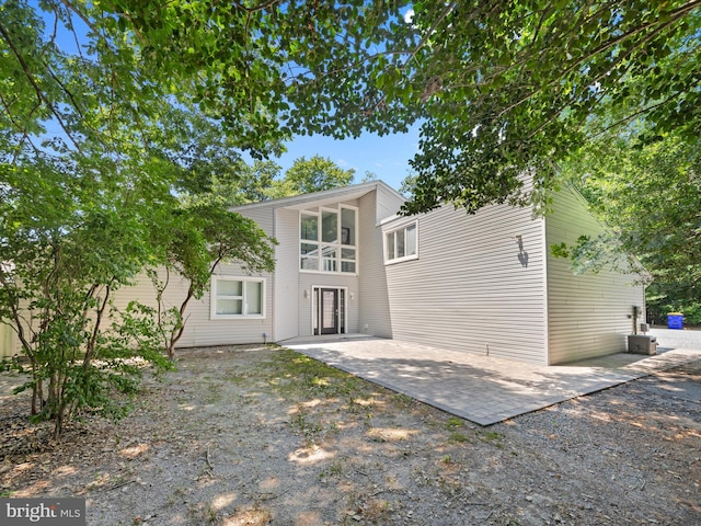 rear view of property featuring a patio