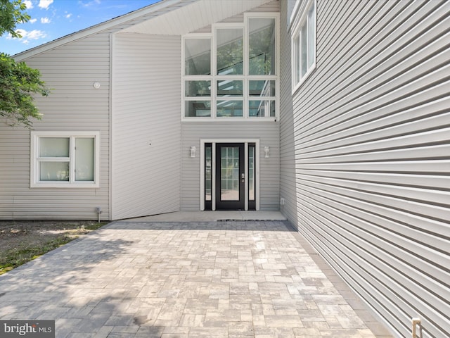 property entrance with a patio area