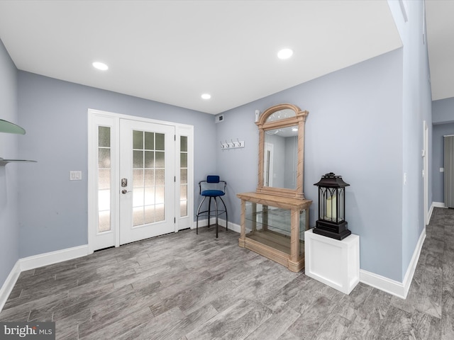 foyer entrance with hardwood / wood-style flooring