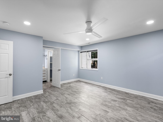 unfurnished bedroom featuring hardwood / wood-style floors and ceiling fan