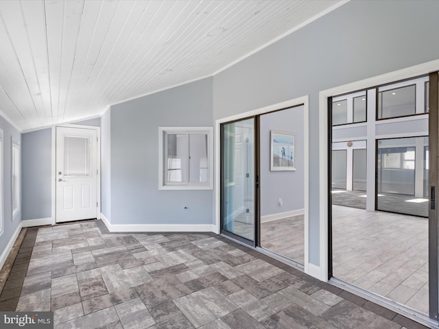 spare room with wood ceiling, crown molding, and vaulted ceiling