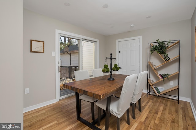 dining area with light hardwood / wood-style floors