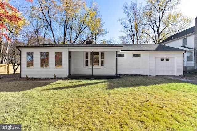 single story home with a front lawn and a garage