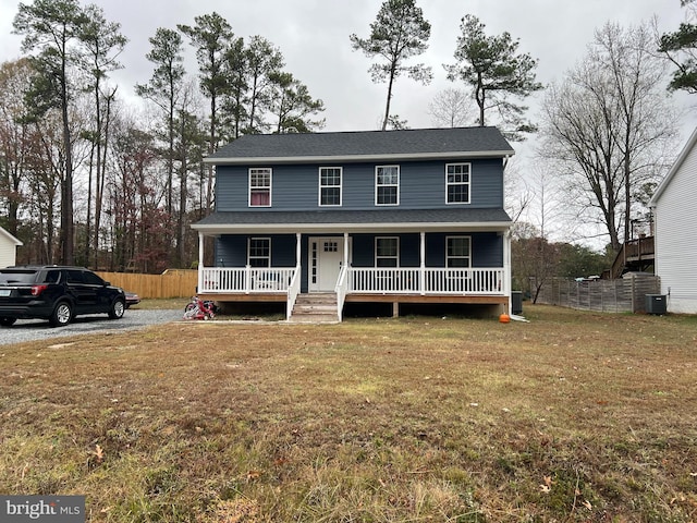 view of front of property with a porch and a front yard