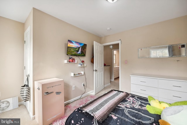 bedroom with light colored carpet