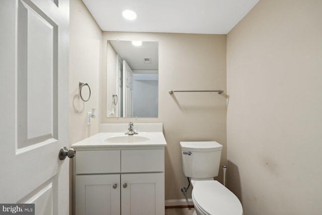 bathroom with vanity and toilet