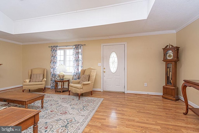 foyer featuring light hardwood / wood-style floors and crown molding