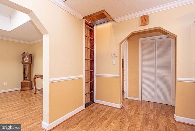 hall featuring crown molding and light wood-type flooring