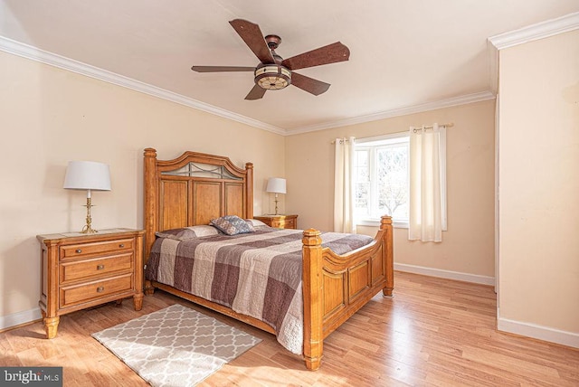 bedroom featuring light hardwood / wood-style floors, ceiling fan, and ornamental molding