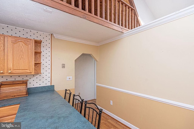 dining space featuring wood-type flooring and ornamental molding