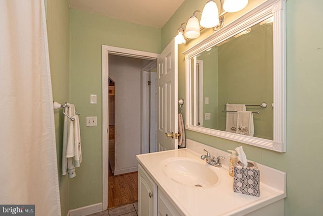 bathroom featuring hardwood / wood-style flooring and vanity