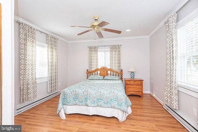 bedroom with hardwood / wood-style flooring, baseboard heating, and ceiling fan