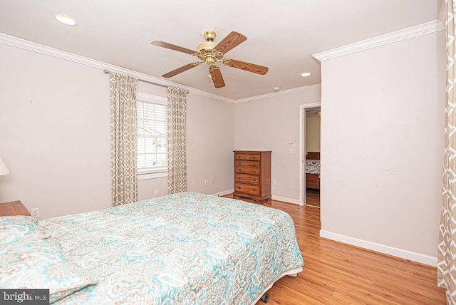 bedroom with ceiling fan, crown molding, and wood-type flooring