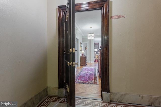 corridor featuring crown molding