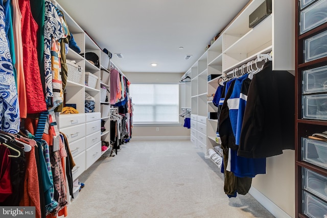 spacious closet featuring light carpet and visible vents